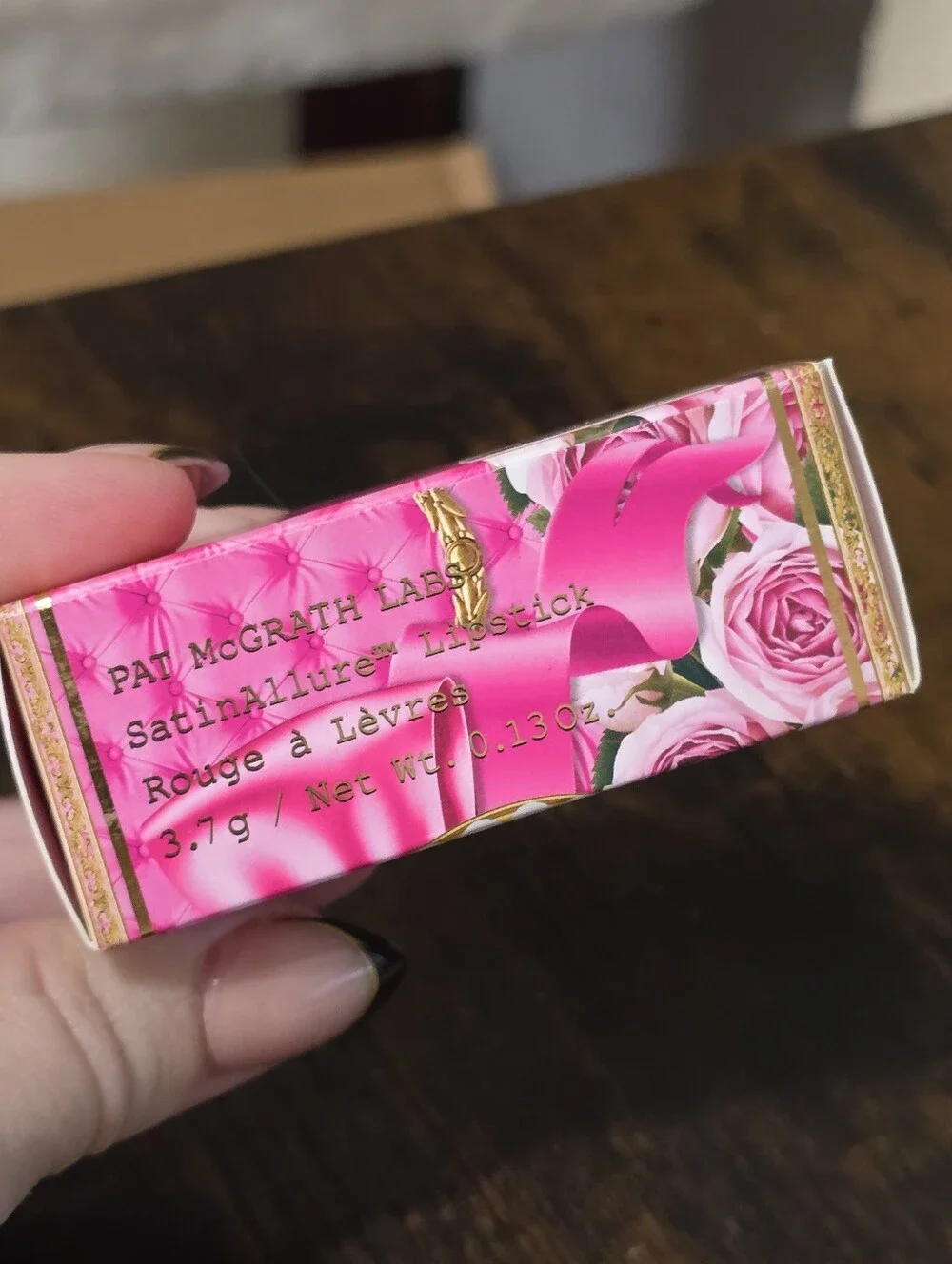 Petallicia Bright Coral Pink Lipstick with Gold Bow Accent